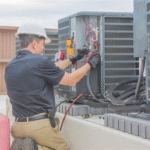 tech performing maintenance on hvac system